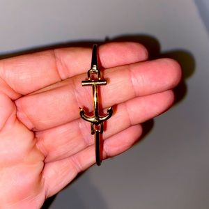 Gold anchor bracelet.